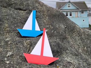 Blue and red origami boats in Everett, Washington, USA
