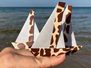 3 origami sailboats sailing on the Black Sea