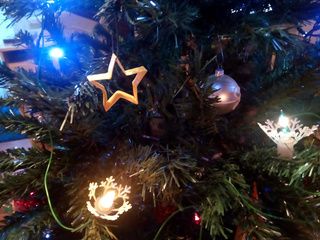 Origami Christmas star ornament in a Christmas tree made by Ladislav Kaňka