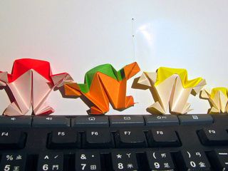 Standing and slanting origami frogs